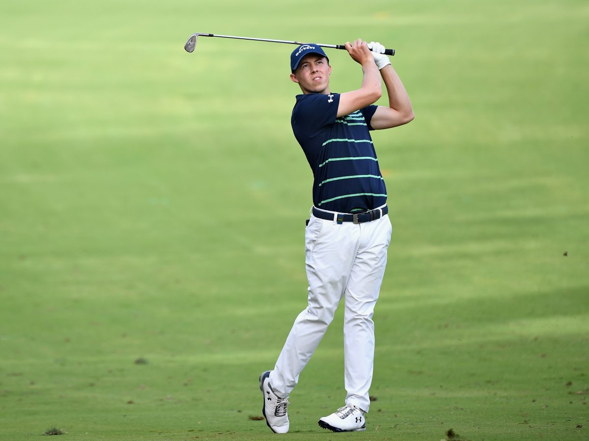 Matthew Fitzpatrick of England takes his second shot on the 14th hole in the Dubai Desert Classic at Emirates Golf Club. (Ross Kinnaird/Getty Images)