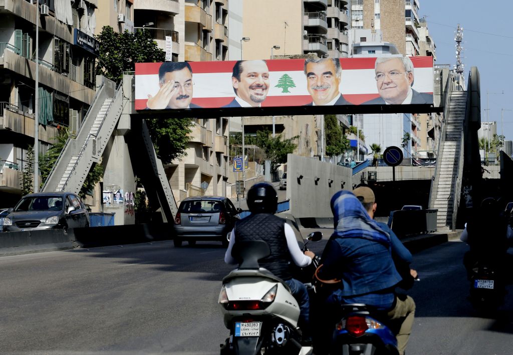 A picture taken on November 5 2017 shows motorbikes driving past a banner bearing a portrait of Lebanese Prime Minister Saad Hariri in the capital Beirut a day following the announcement of his resignation.
Photo: ANWAR AMRO/AFP/Getty Images.