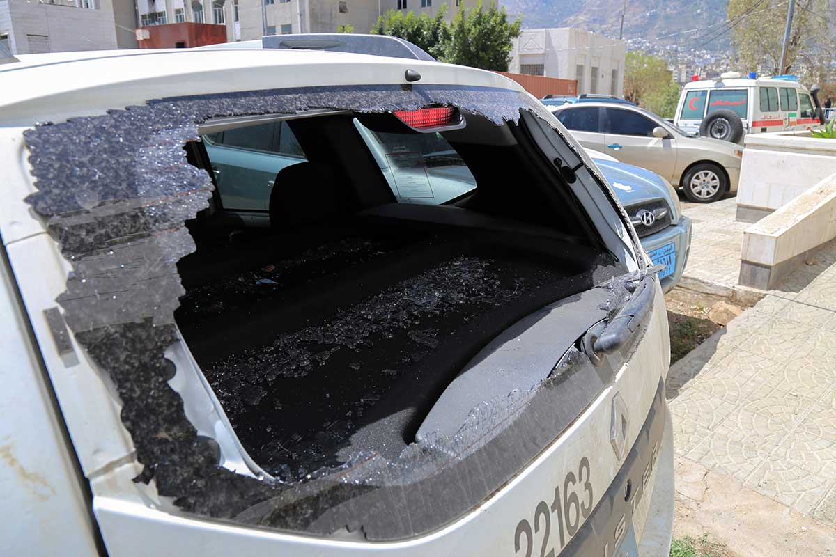 Shattered rear window of the Red Cross vehicle that was carrying Red Cross employee Hanna Lahoud, parked outside a hospital in the country's third-city of Taiz.