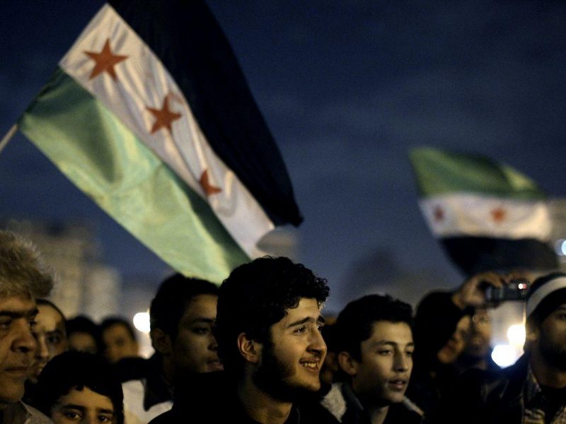 Syrian protesters hold a rally outside the Arab League offices in Cairo