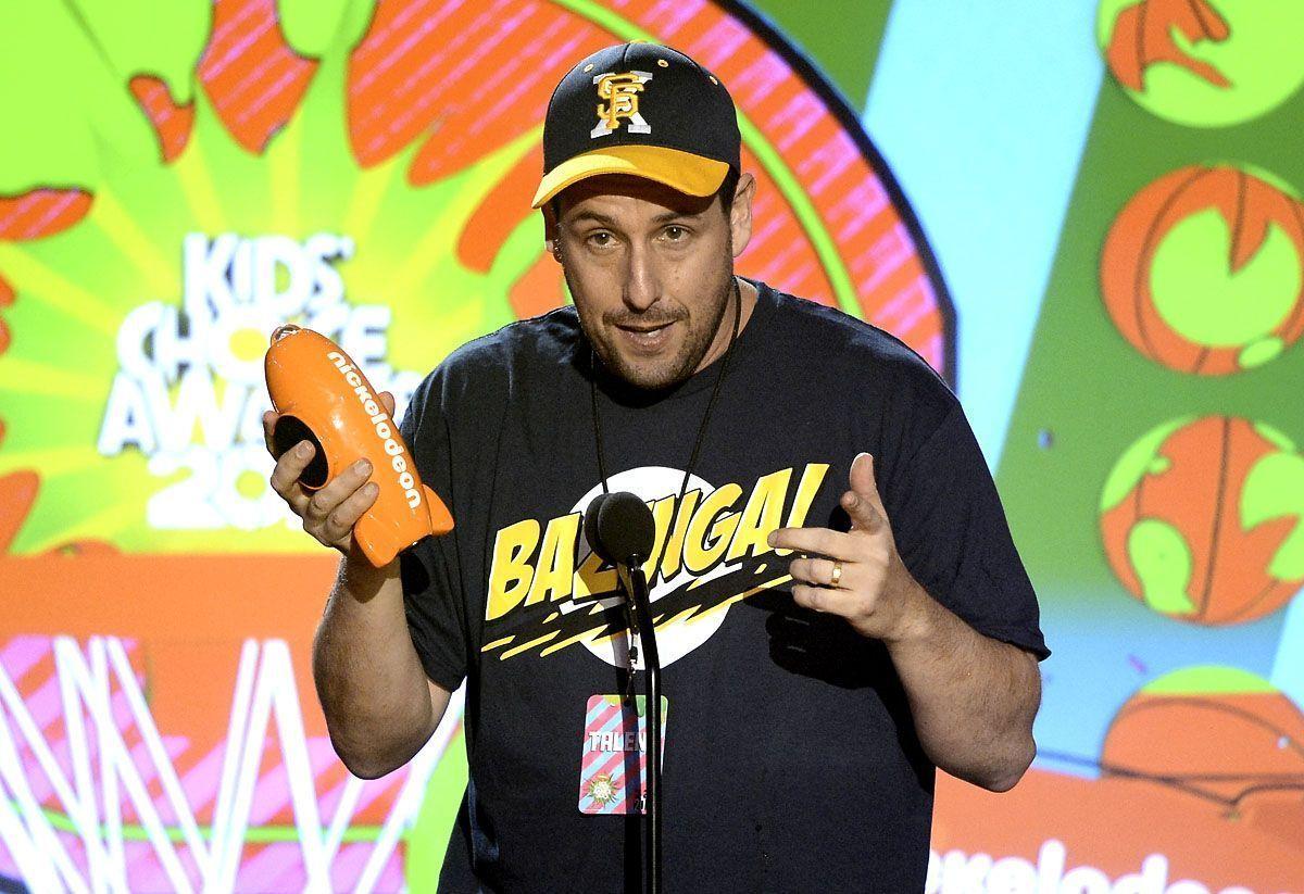 Actor Adam Sandler accepts an award at a previous Nickelodeon Kids Choice Awards in Los Angeles.