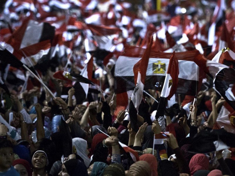 People celebrate at Tahrir Square after a broadcast by the head of the Egyptian military confirming that they will temporarily be taking over from the countrys first democratically elected president Mohammed Morsi on July 3, 2013 in Cairo. In their tens of thousands, they cheered, ignited firecrackers and honked horns as soon as the army a