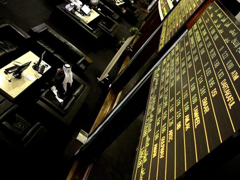 An Emirati man follows the stock market activity at the Dubai Financial Market in the Gulf emirate on December 14, 2009. Dubais stock market rose 10.13 percent in early trade after the government said it will pay 4.1 billion dollars to cover maturing Islamic bonds issued by its Nakheel property developer. (AFP/Getty Images)