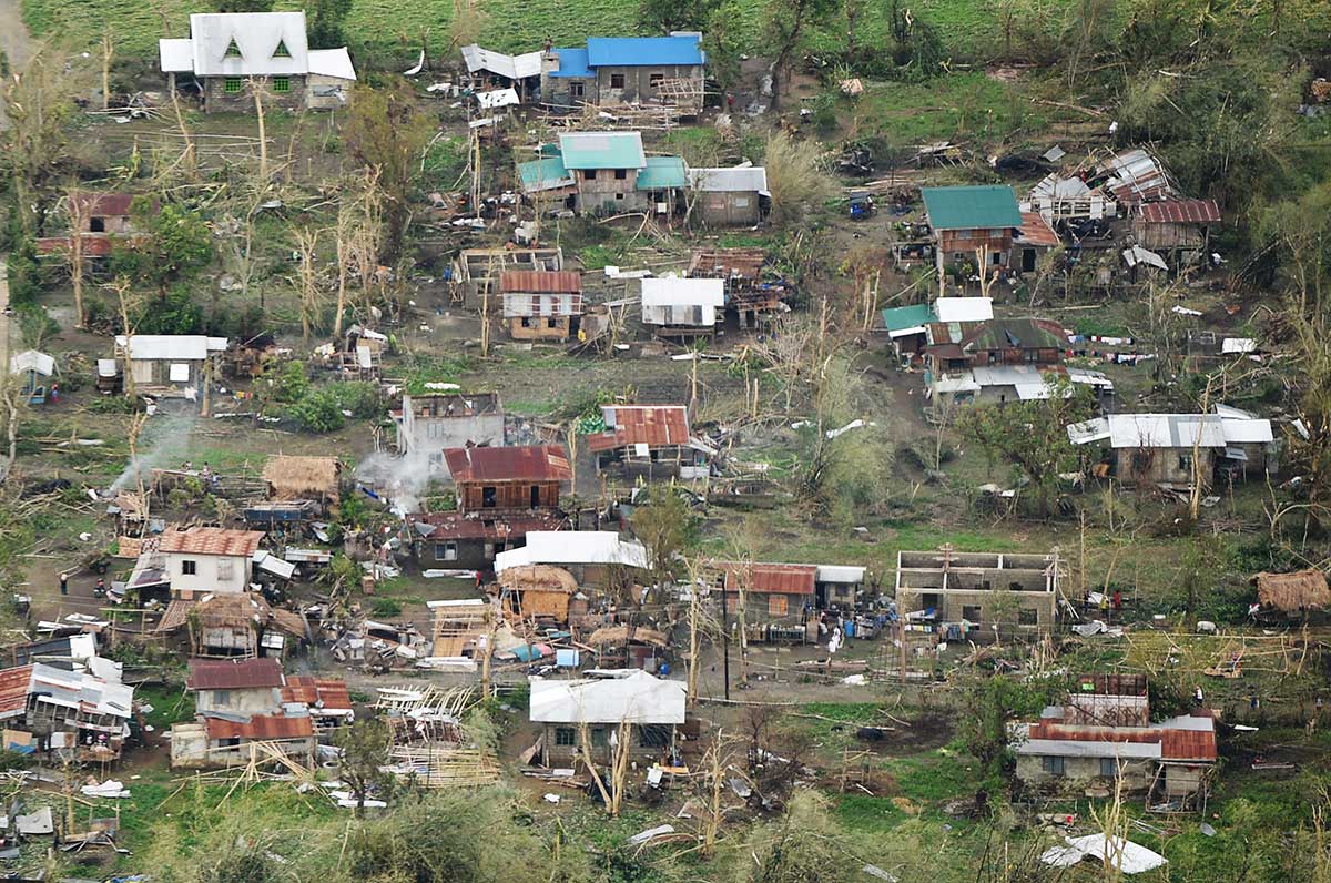 Typhoon Mangkhut killed at least 25 people in the Philippines as it smashed homes and left behind torrents of floodwater.