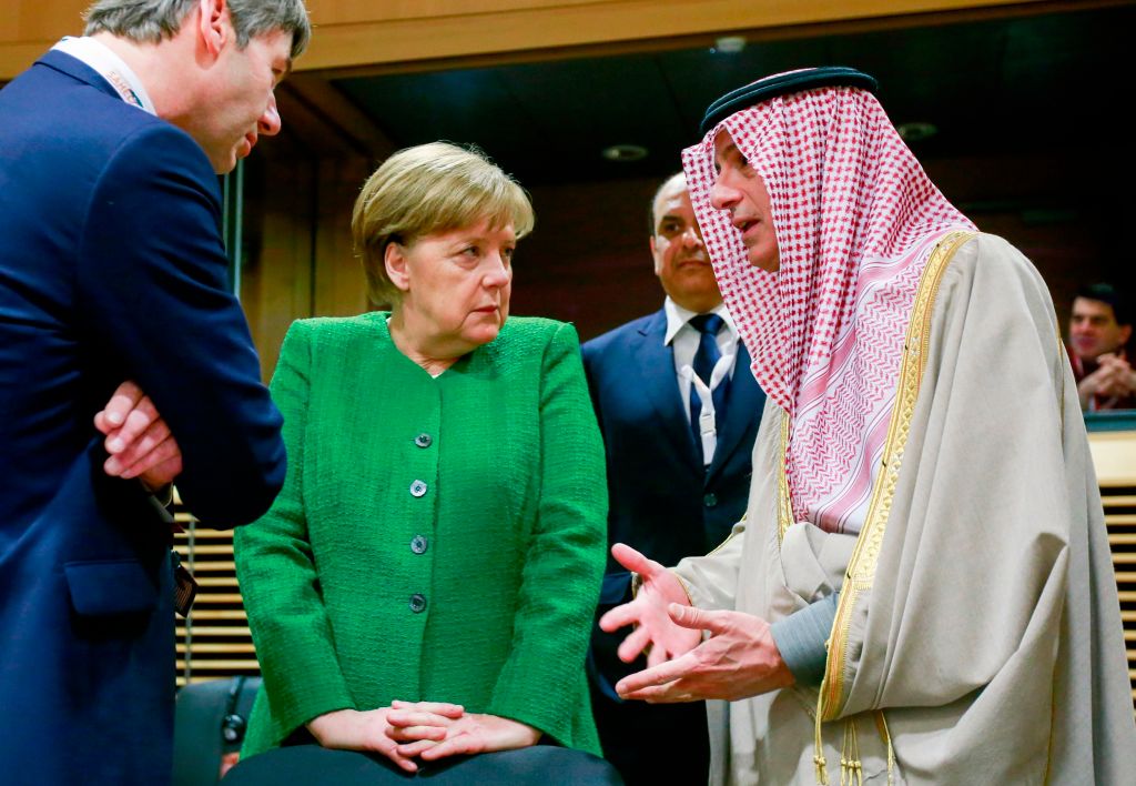 Germany's Chancellor Angela Merkel (centre) speaks with Saudi Arabia's Foreign Minister Adel alJubeir R as they arrive to attend a High Level Conference on the Sahel at the European Commission in Brussels on February 23 2018. 
Image: OLIVIER HOSLET/AFP/Getty Images