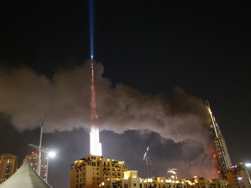 The Address Downtown hotel burning after huge fire ripped through the luxury hotel near the worlds tallest tower on December 31, 2015. (Photo credit should read KARIM SAHIB/AFP/Getty Images)]