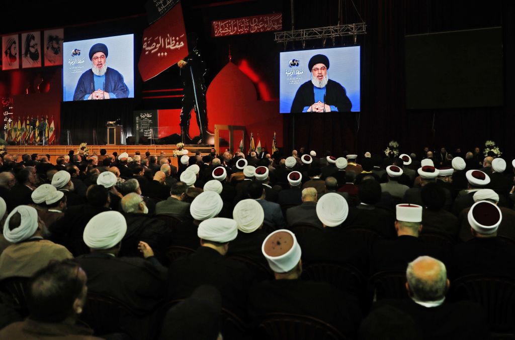 Lebanese Hezbollah Leader Hassan Nasrallah delivers a televised speech during a ceremony held by the Shiite party in the capital Beirut. Photo: JOSEPH EID/AFP/Getty Images.