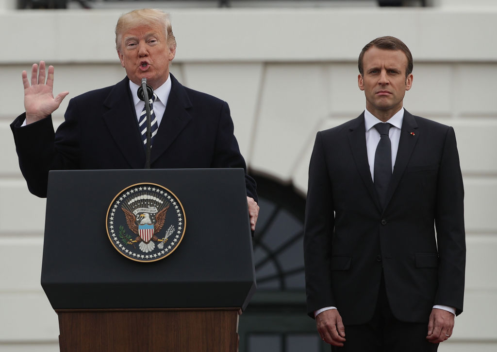 US President Donald Trump L and French President Emmanuel Macron R participate in a state arrival ceremony at the South Lawn of the White House
Photo: Alex Wong/Getty Images