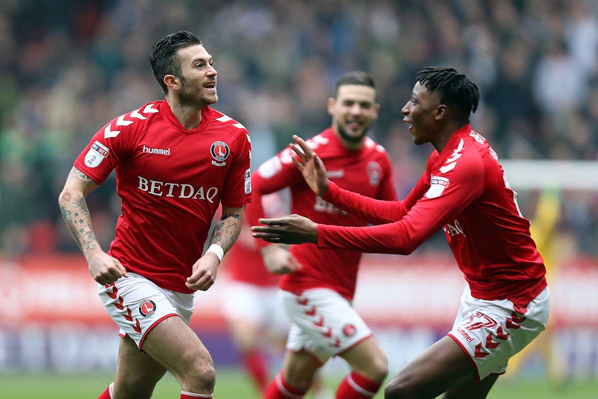 Lewis Page of Charlton Athletic celebrates with team mate Joe Aribo after scoring the opening goal during the Sky Bet League One match between Charlton Athletic and Plymouth Argyle at The Valley on March 24, 2018 in London, England.