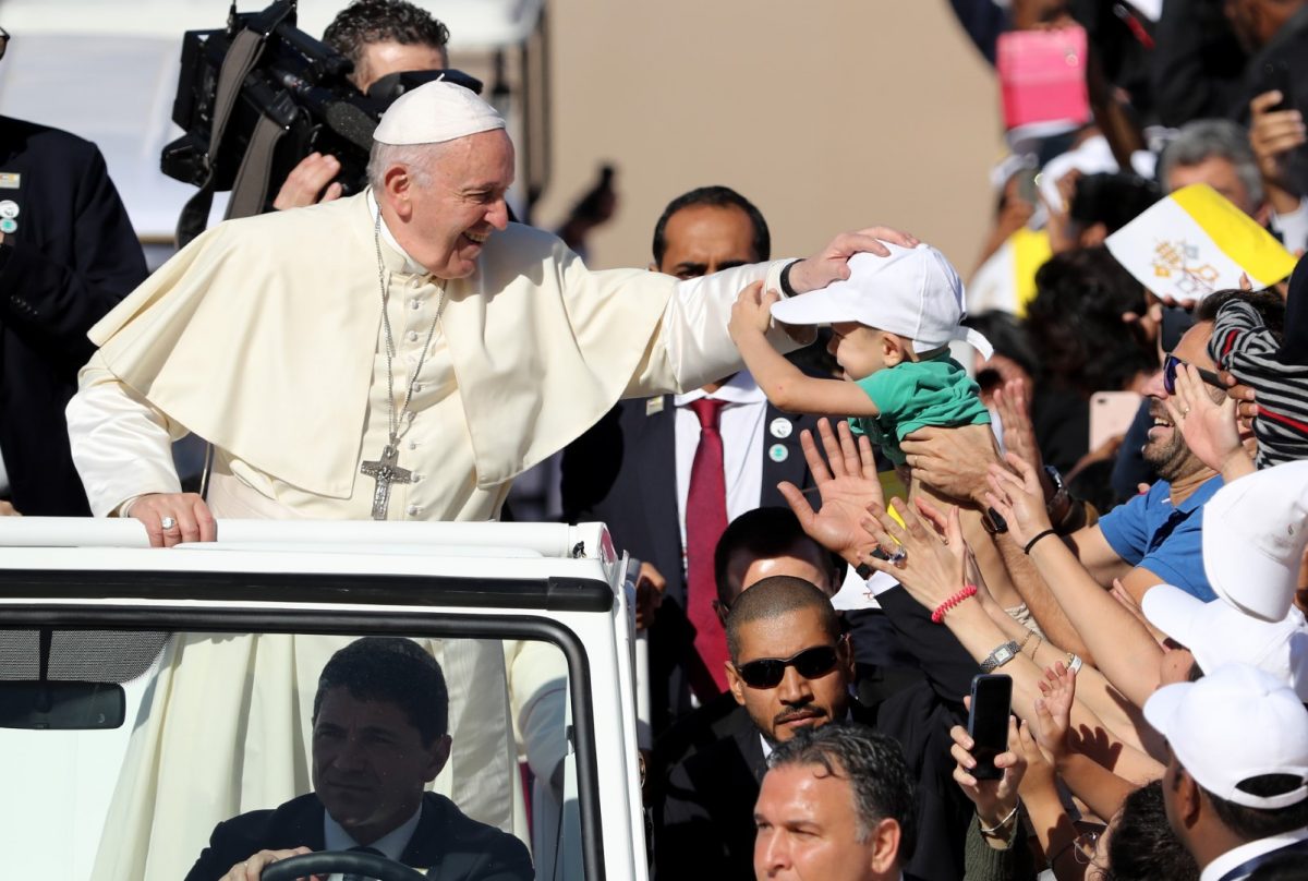 Pope Francis blesses a child as he arrives to lead mass for an estimated 170,000 Catholics at the Zayed Sports City Stadium on February 5. (KARIM SAHIB/AFP/Getty Images)