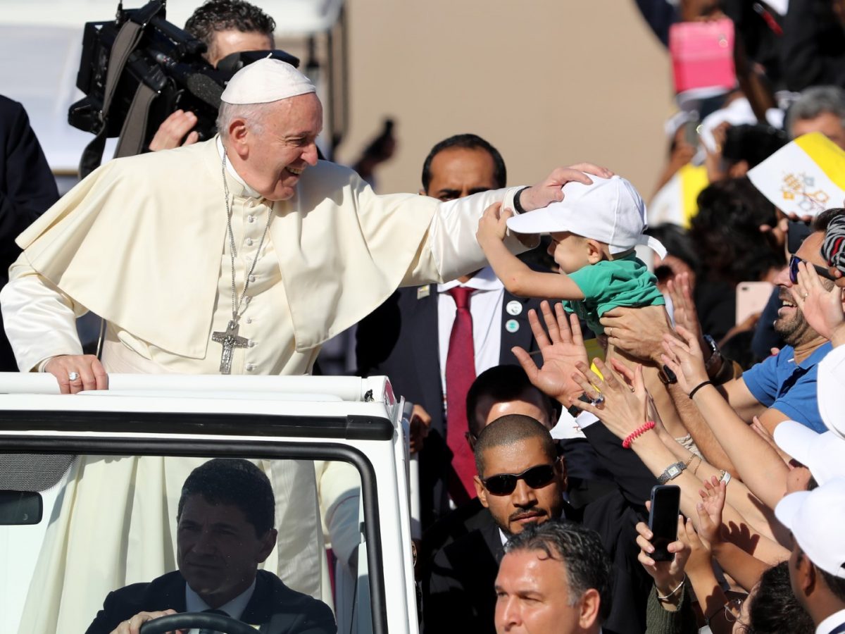 Pope Francis blesses a child as he arrives to lead mass for an estimated 170,000 Catholics at the Zayed Sports City Stadium on February 5. (KARIM SAHIB/AFP/Getty Images)