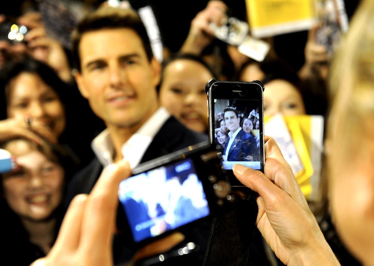 Tom Cruise greets fans on the red carpet at Dubai International Film Festival