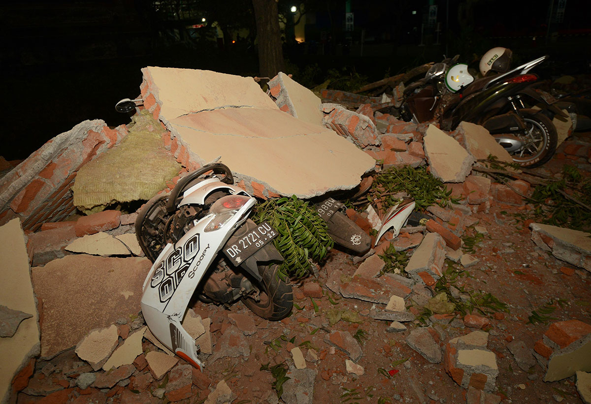 Bikes are seen covered in debris at a mall in Bali's capital Denpasar on August 5, 2018 after a major earthquake rocked the neighbouring Lombok island.