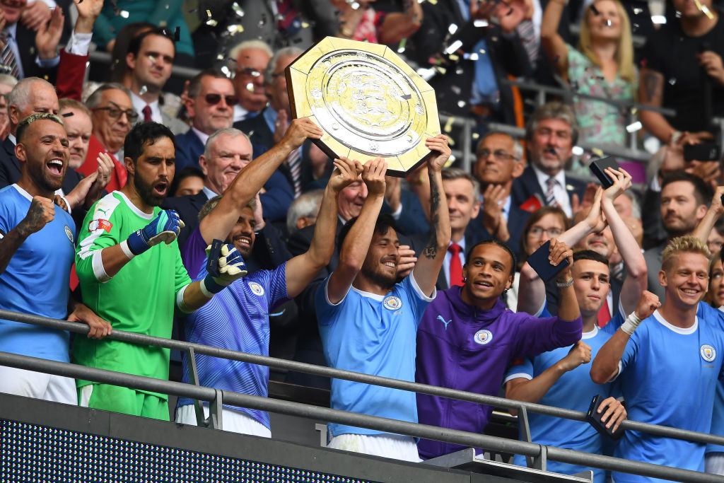 David Silva and Sergio Aguero of Manchester City lift the FA Community Shield