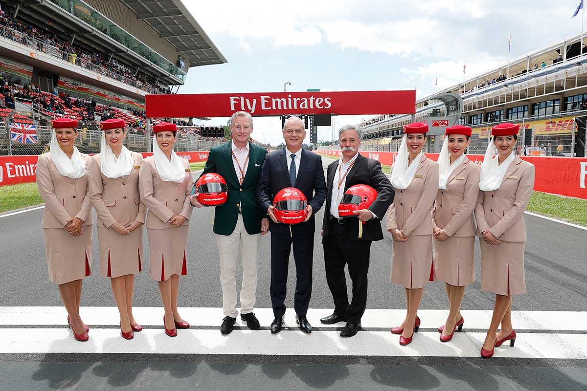 From left to right: Sean Bratches, Managing Director, Commercial Operations at Formula 1, Thierry Antinori, Emirates Executive Vice President and Chief Commercial Officer, and Chase Carey, Chief Executive Officer of the Formula One Group, flanked by Emirates Cabin Crew, before the start of today’s Spanish Grand Prix, of which Emirates is t