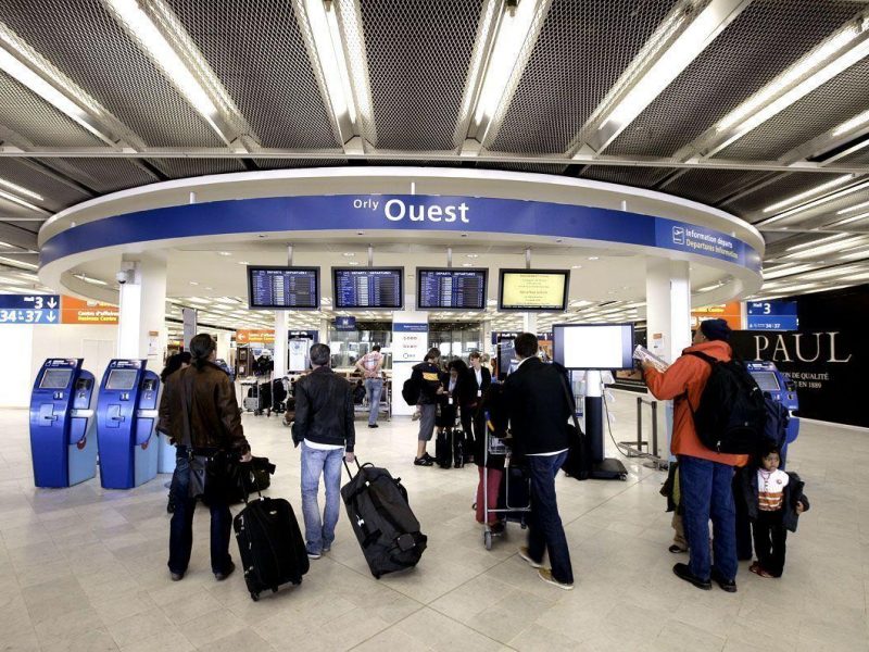 Passengers review cancelled flights at Orly airport, France