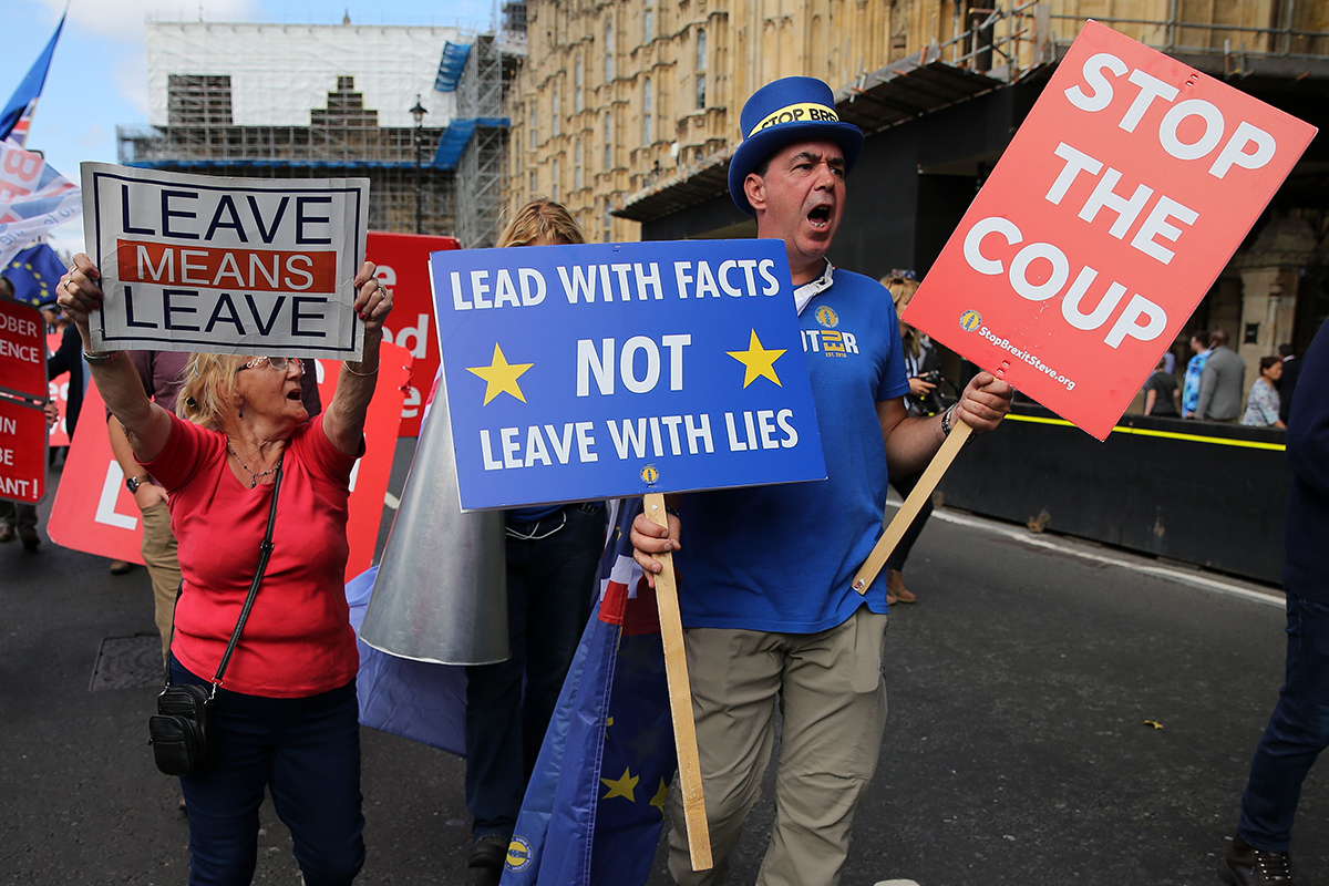 A pro-Brexit activist (L) remonstrates with anti-Brexit activist Steve Bray outside the Houses of Parliament in central London on September 3, 2019.