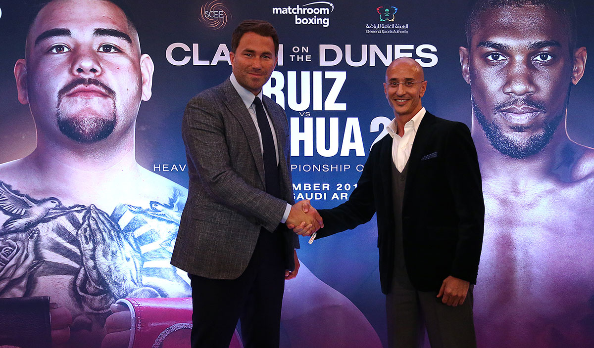 Eddie Hearn, managing director of Matchroom Sport and Omar Khalil, Managing Partner of Skill Challenge Entertainment, official event partner in The Kingdom of Saudi Arabia shake hands after a press conference to formally announce 'Clash on the Dunes' at The Savoy hotel on August 12, 2019 in London, England.