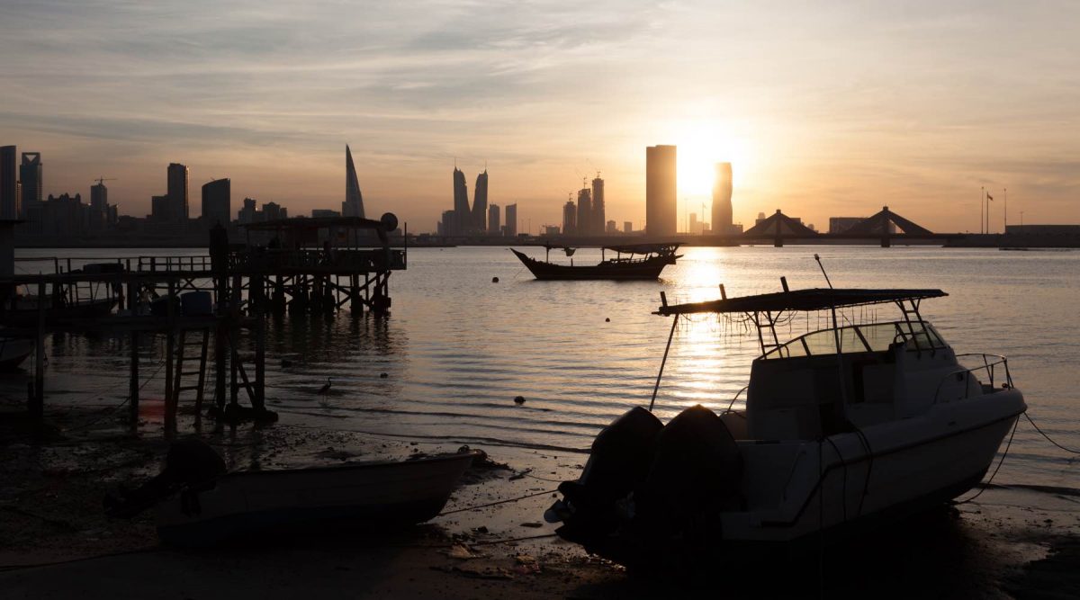 Fishing pier and boats in Manama at sunset Kingdom of Bahrain Middle East