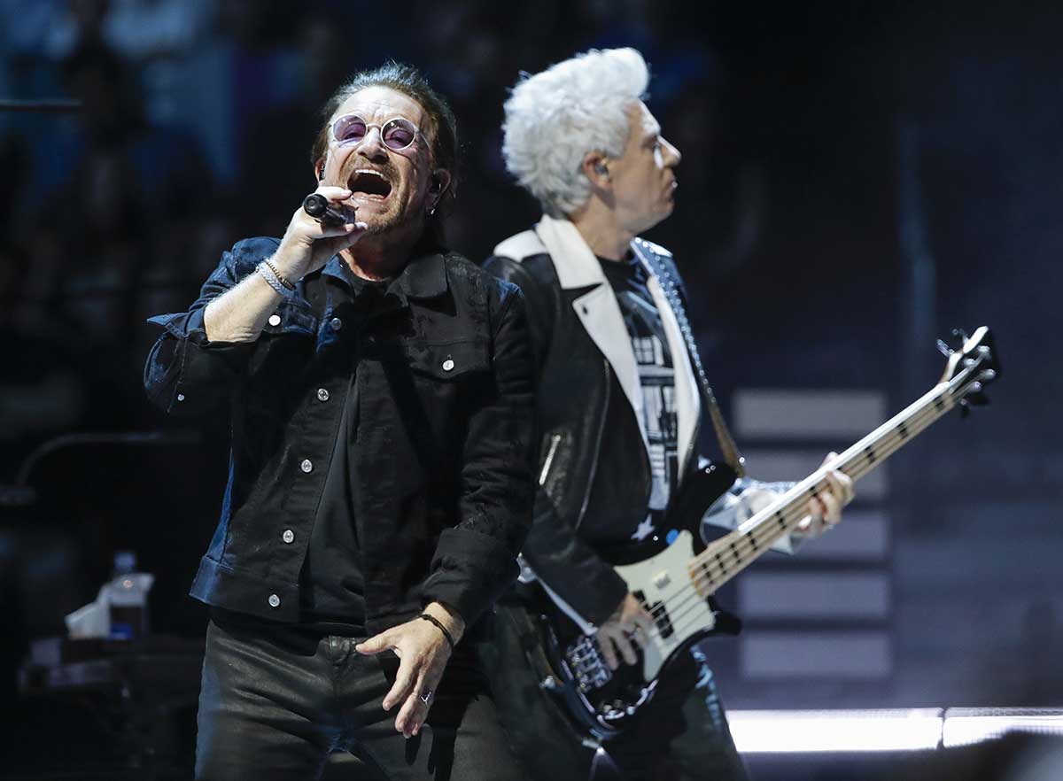 Bono (L) and Adam Clayton (R) of the Irish rock band U2 perform during the 'Experience + Innocence' tour at the United Center on May 23, 2018 in Chicago.