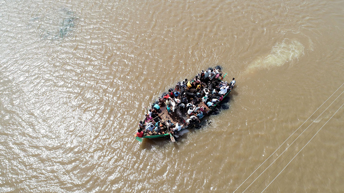 An aerial view of locals being rescued on a boat in waterlogged Jamkhandi Taluk at Belgaum district of Karnataka state situated about 525 kms north of the south Indian city of Bangalore.