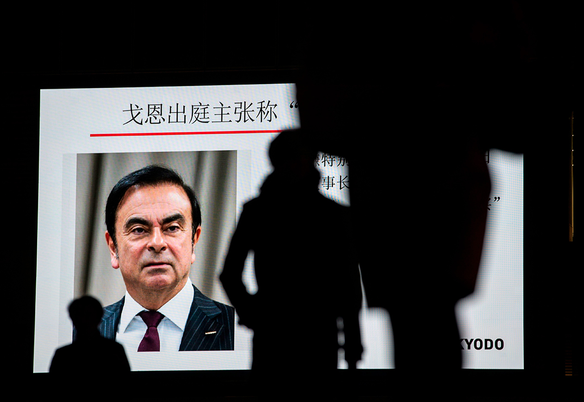 Carlos Ghosn is accusing the Japanese manufacturers of breaching his contract as an employee of NMBV, their joint subsidiary based in the Netherlands, and seeking up to 15 million euros ($16.8 million) in damages.