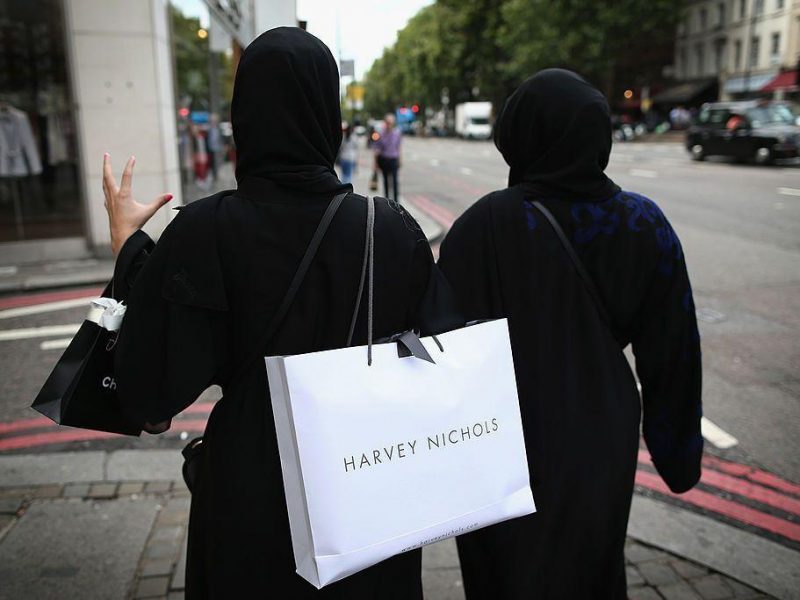 Two muslim women wearing black Abayas and head scarfs walk through Knightsbridge in London. (Photo by Dan Kitwood/Getty Images)]