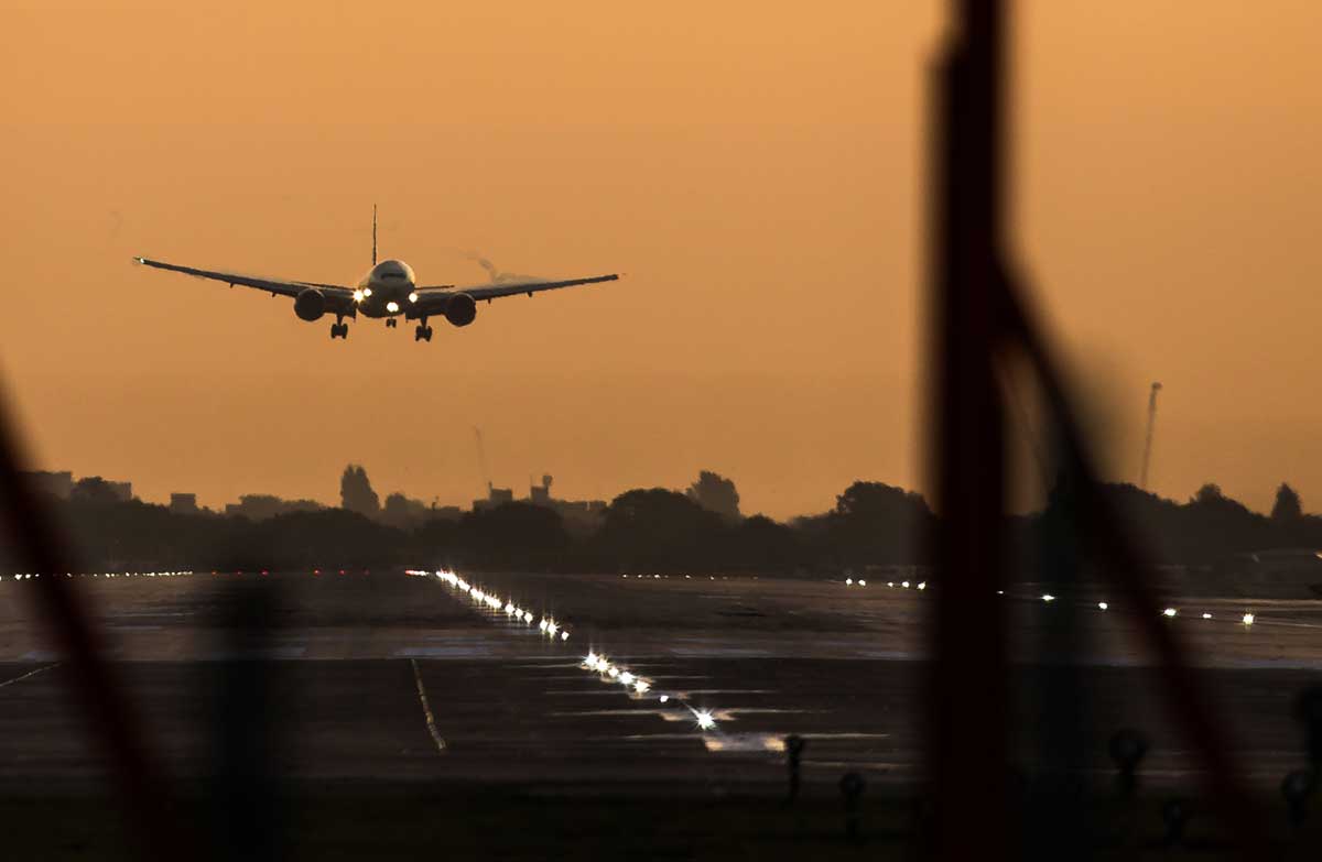 A passenger aircraft prepares to land during sunrise at London Heathrow Airport in west London. (Daniel Leal-Olivas/AFP/Getty Images)