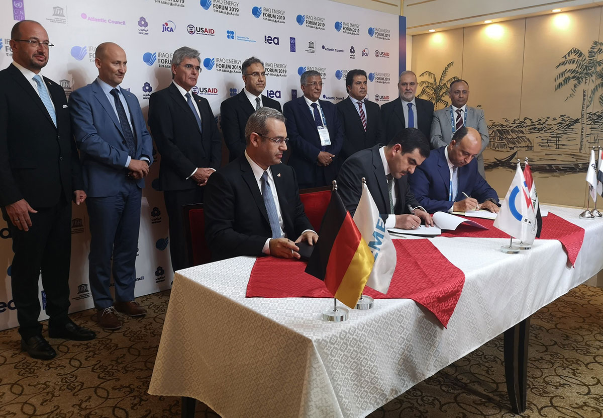 From (L to R) Karim Amin, CEO of Siemens Power Generation, Waleed Khaled Hassan, director general, general state company for electricity production north region and Orascom CEO Osama Bishai, sign a contract in the Iraqi capital Baghdad.