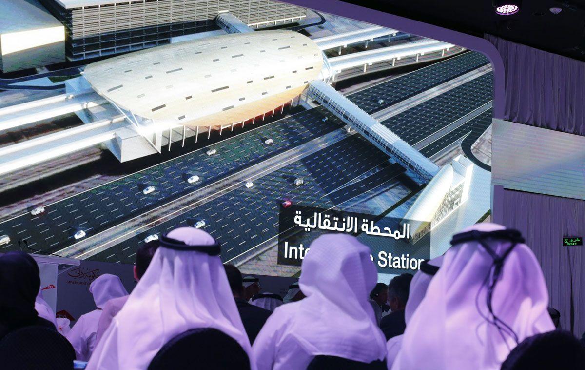 People watch a presentation of the Route 2020 metro expansion project during a press conference. (Karim Sahib/AFP/Getty Images)