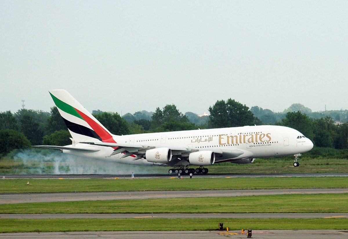 An Emirates airline flight from Dubai touches down to land at John F. Kennedy International Airport in New York.