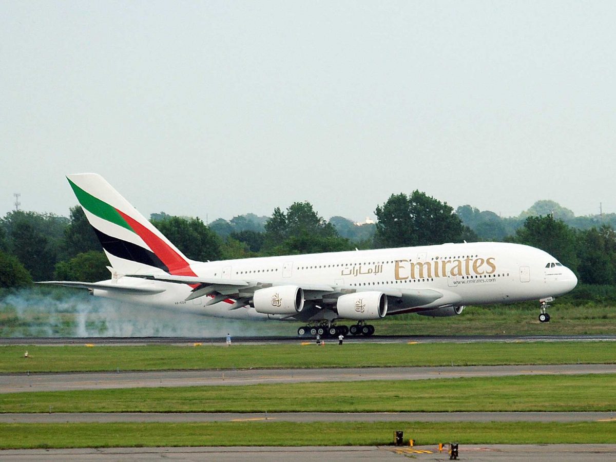 An Emirates airline flight from Dubai touches down to land at John F. Kennedy International Airport in New York.