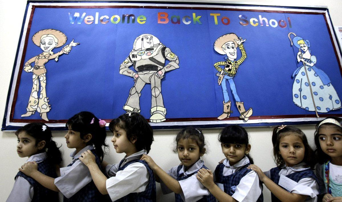 Students line-up to enter their classroom on the first day of the academic year for public schools in Dubai. (Getty Images)