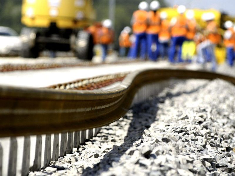 Workers install the first track of the new French high speed train (TGV) Lyon-Strasbourg line in Les Magny, eastern France, on June 29, 2009. The line will be opened in 2011. AFP PHOTO SEBASTIEN BOZON (Photo credit should read SEBASTIEN BOZON/AFP/Getty Images)