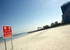 KUWAIT BEACH: A sign prohibiting swimming and fishing in the sea is seen at one of the main beaches in Kuwait City. (Getty Images)