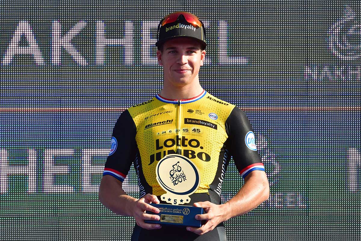 Dutch rider Dylan Groenewegen of team Lotto NL-Jumbo stands on the podium after winning the first stage of the Dubai Tour from Sky Dive Dubai to Palm Jumeirah in Dubai on February 6, 2018.