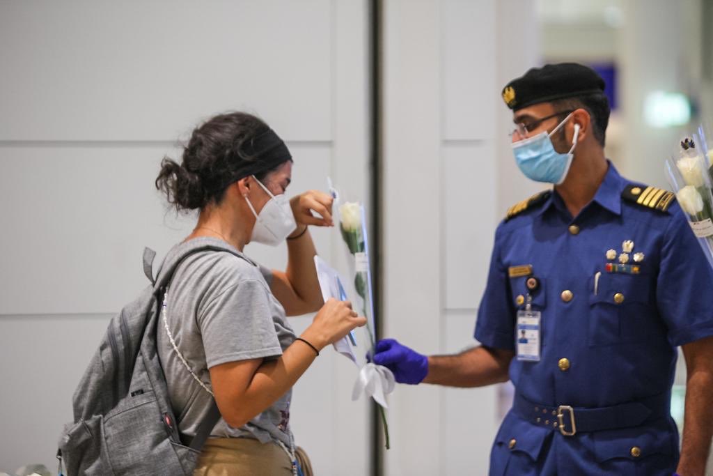 In pictures: Dubai airport welcomes Lebanese travelers with white roses ...