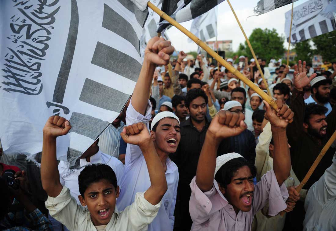 Activists of Pakistani Jamaat-ud-Dawa chant slogans during Muslim funeral prayers for Osama bin Laden on a street in Karachi on May 3, 2011. (AFP/Getty Images)