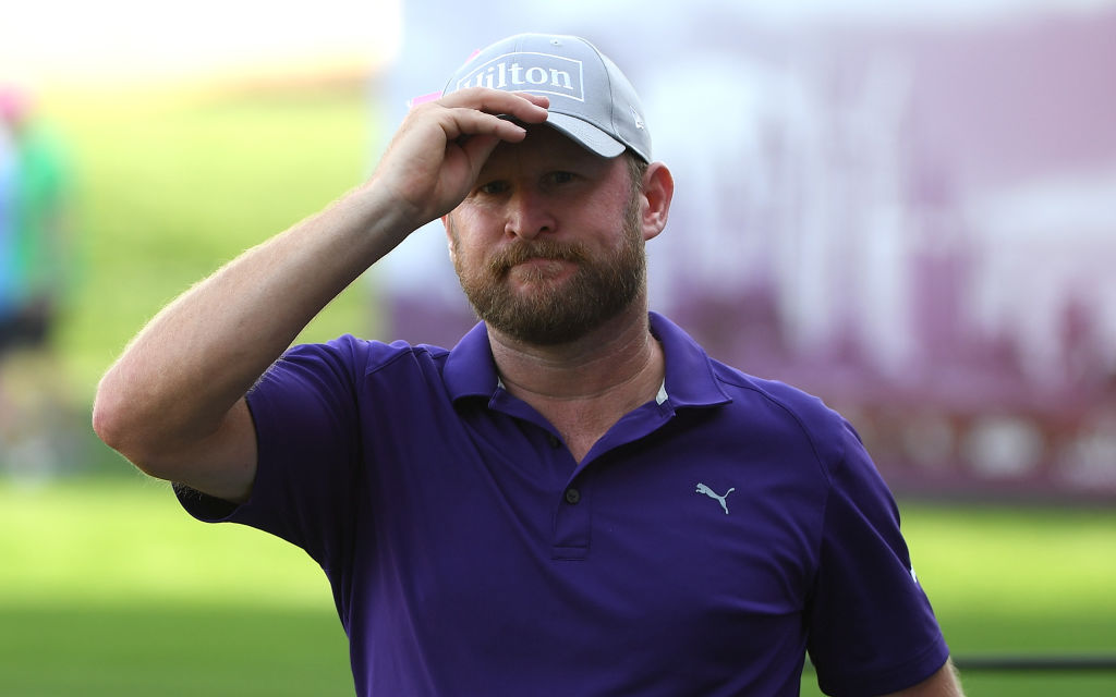 Jamie Donaldson of Wales walks off the 18th hole during round two of the Omega Dubai Desert Classic at Emirates Golf Club. (Ross Kinnaird/Getty Images)