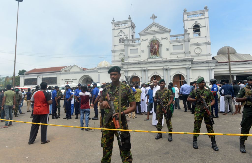 Sri Lankan security personnel keep watch outside the church premises following a blast at the St Anthonys Shrine in Kochchikade Colombo.