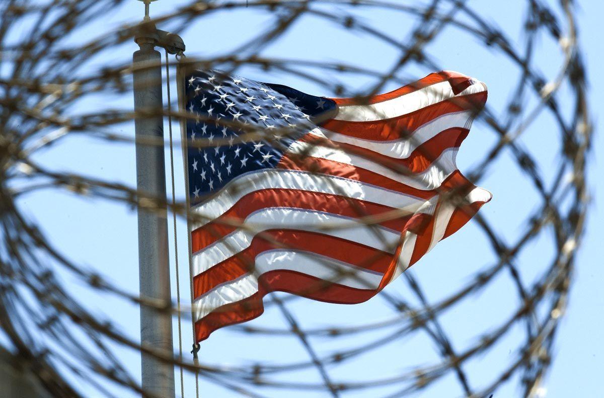 The US flag is seen flying between the maximun security detainee camps 5 and 6 part of the US Detention Centre at Guantanamo Bay, Cuba. (PAUL J RICHARDS/AFP/Getty Images)