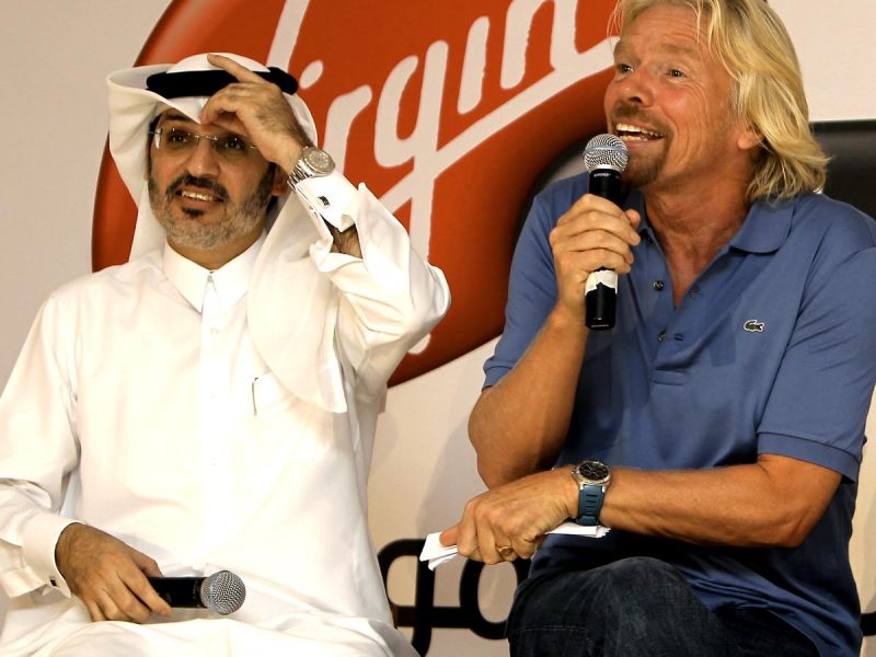 Virgin Group founder Richard Branson (R) speaks during a joint press conference with Nasser Marafih, chief executive officer of Qtel, at the launch of Virgin Mobile Qatar. (Getty Images)