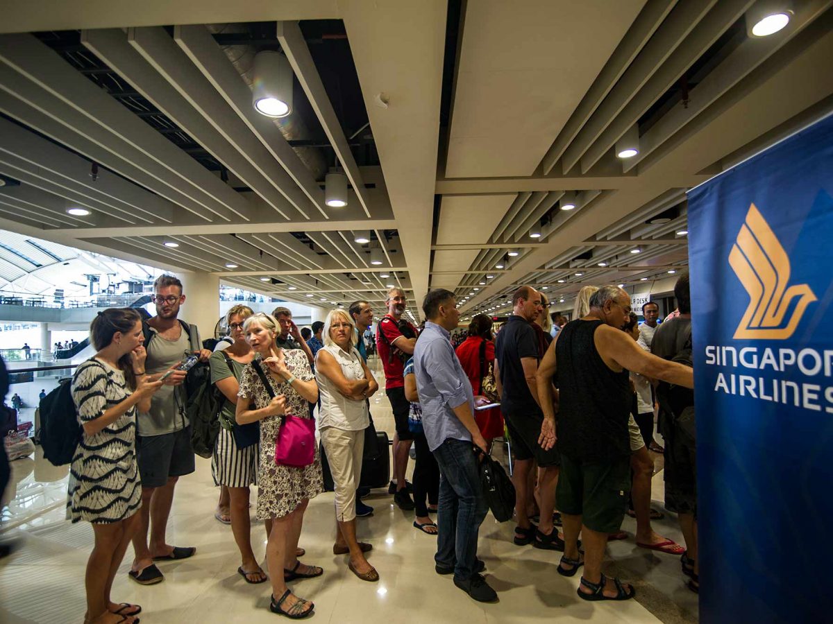 Passengers gather at the Ngurah Rai International airport in Denpasar, Bali. (JUNI KRISWANTO/AFP/Getty Images)