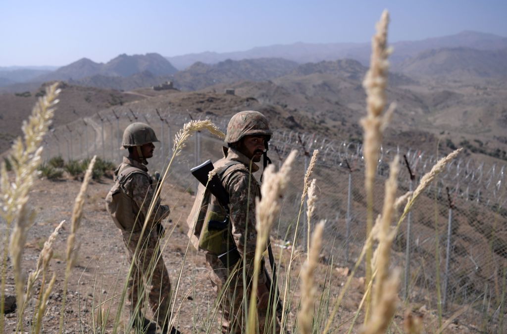 Pakistani soldiers keep vigil next to a newly fenced border fencing along Afghan border at Kitton Orchard Post in Pakistans North Waziristan tribal agency.
Photo: AAMIR QURESHI/AFP/Getty Images