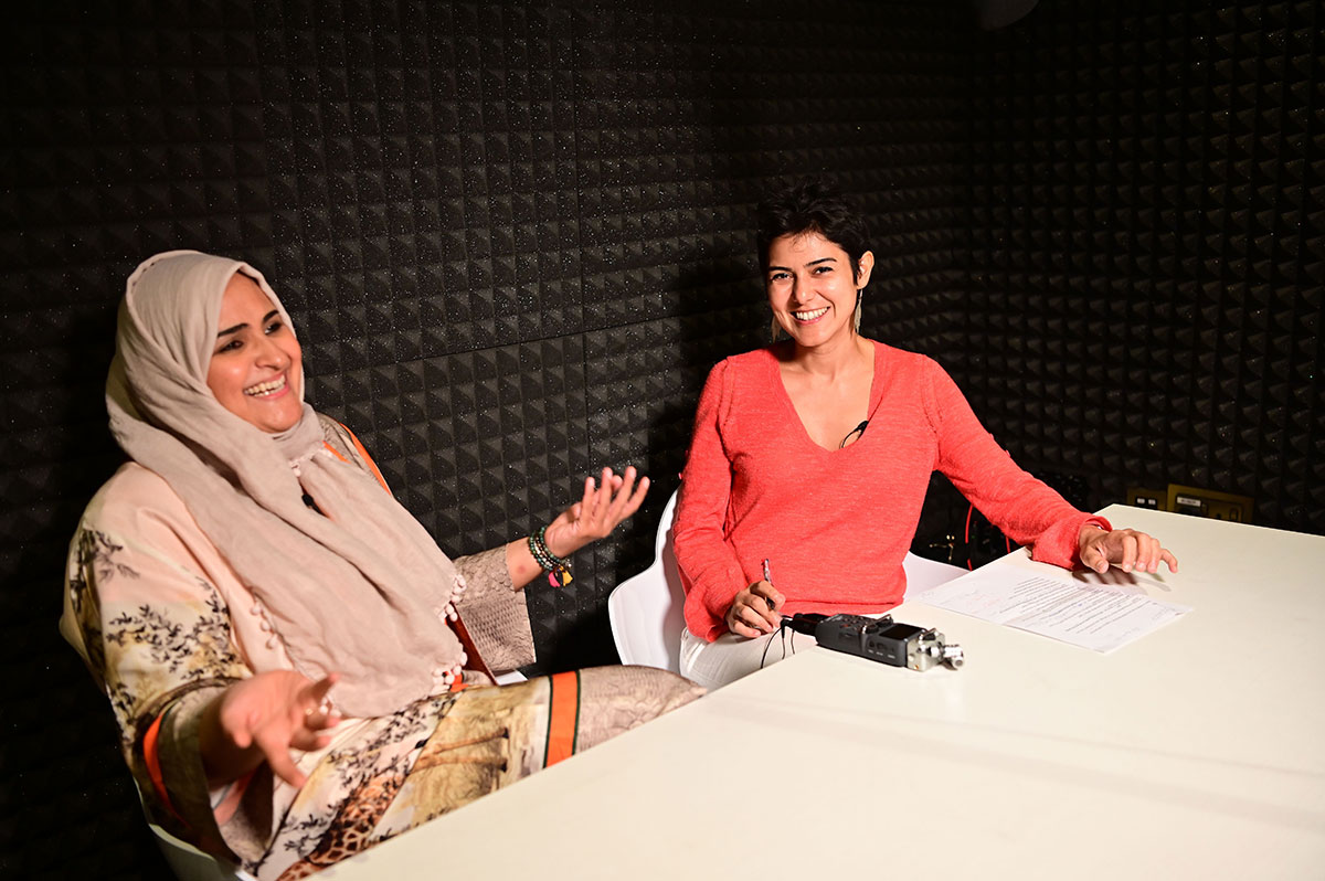 Rana Nawas (R), the producer of the English-language series 'When Women Win', hosts Saudi Arabian comedian and Hatoon Kadi during a podcast recording session in Dubai on April 25, 2019.