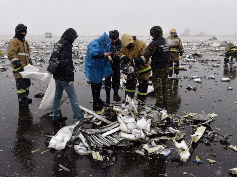 Russian emergency rescuers and forensic investigators work on the wreckage of the flydubai passenger jet which crashed, killing all 62 people on board as it tried to land in bad weather in the city of Rostov-on-Don on March 19, 2016. (AFP/Getty Images)