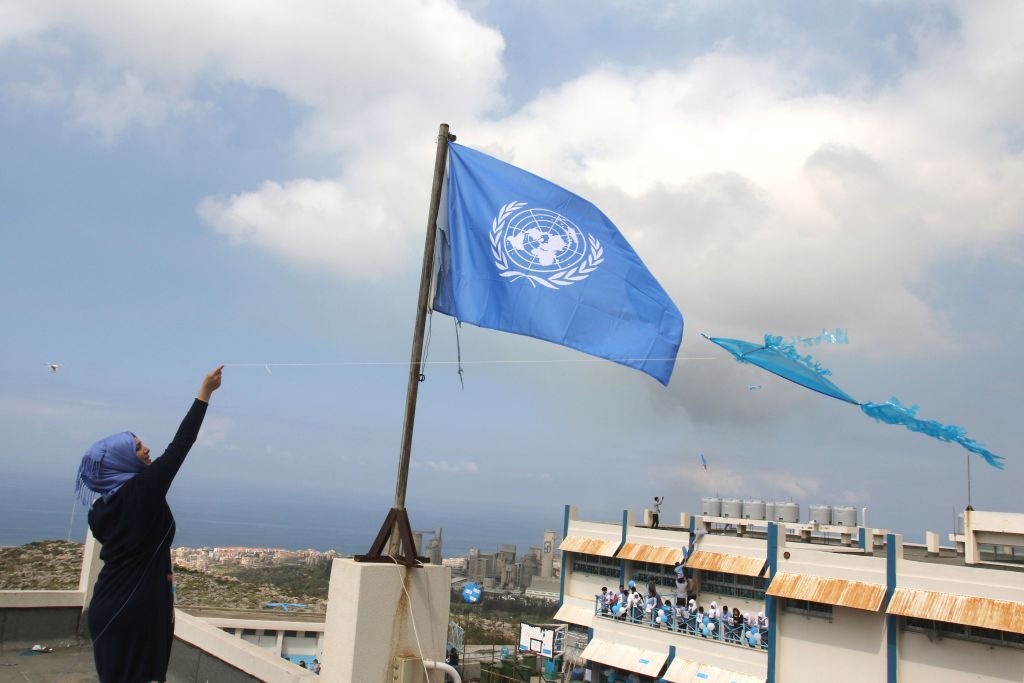 A Palestinian refugee flies a kite at a school belonging to the United Nations Relief and Works Agency for Palestinian Refugees (UNRWA) in the town of Sebline east of the southern Lebanese port of Saida on March 12 2018, during a protest against US aid cuts to the organisation   
 Photo: MAHMOUD ZAYYATAFPGetty Images