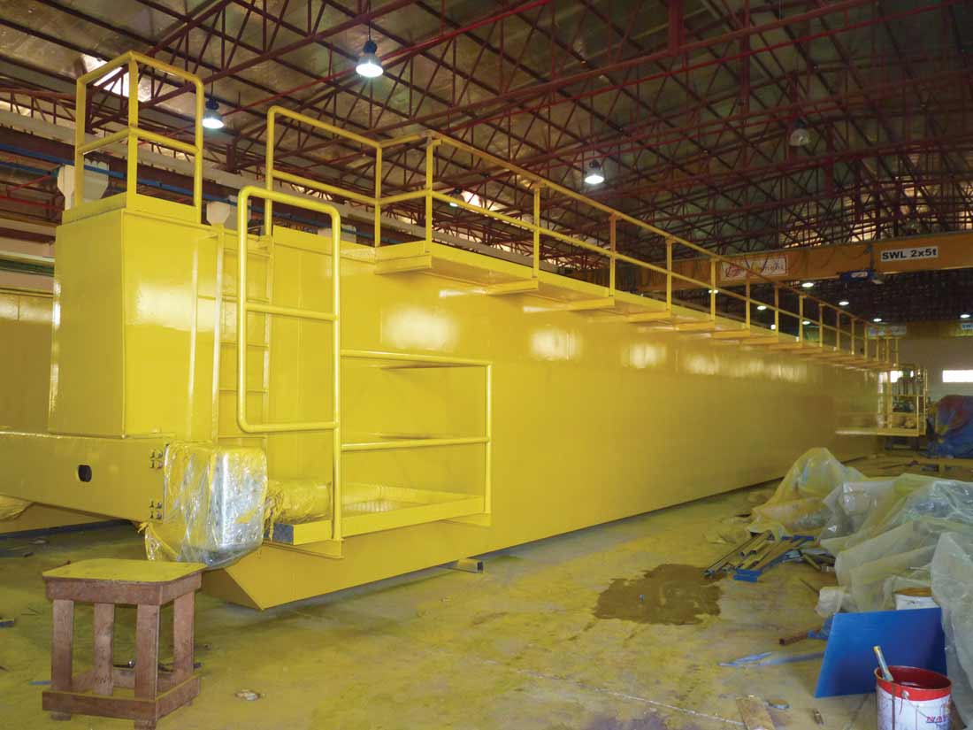 YELLOW STREAK: one of the gantry crane girders sporting its fresh paint job.