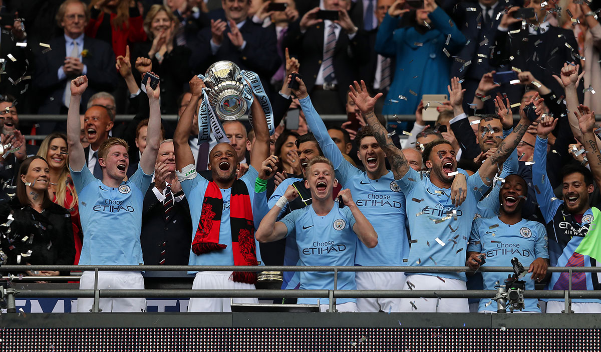 Vincent Kompany of Manchester City lifts the trophy following the FA Cup Final match between Manchester City and Watford at Wembley Stadium on May 18, 2019 in London, England.