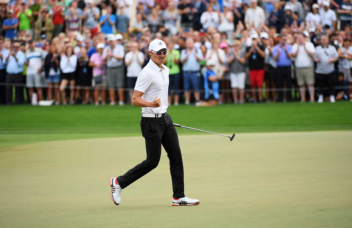 Haotong Li of China celebrates his birdie and victory on the 18th green during the final round on day four of the Omega Dubai Desert Classic at Emirates Golf Club on January 28, 2018 in Dubai.